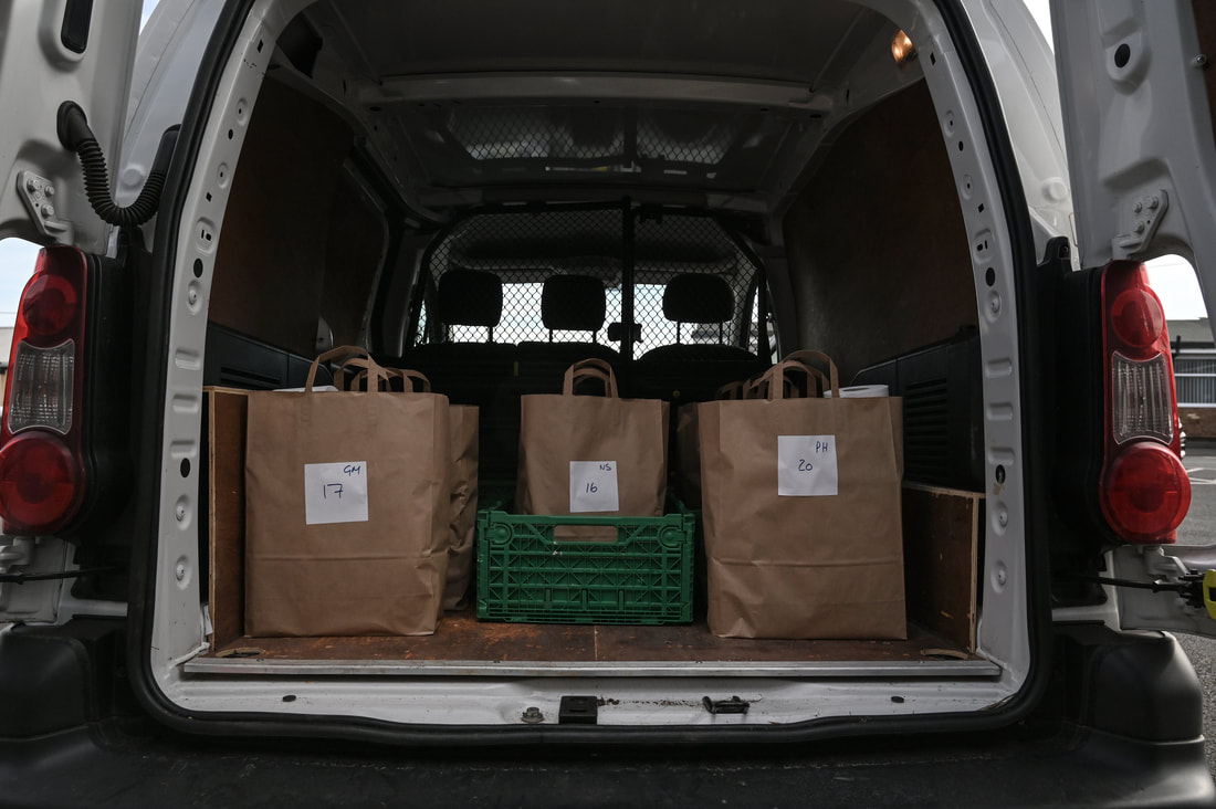 Van loaded with food bags